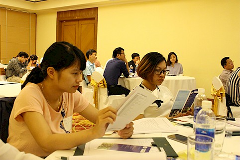 Participants review materials explaining the social, ecological and legislative significance of applying sustainable and fair trade frameworks as part of their corporate social responsibility.