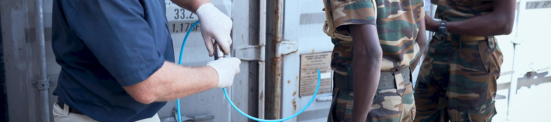 Kenyan Wildlife Service rangers are trained in new technology that involves taking air samples from unopened containers that allow specifically trained dogs and handlers to identify whether the container may hold illicit goods, including ivory and rhino horn © Juozas Cernius / WWF-UK