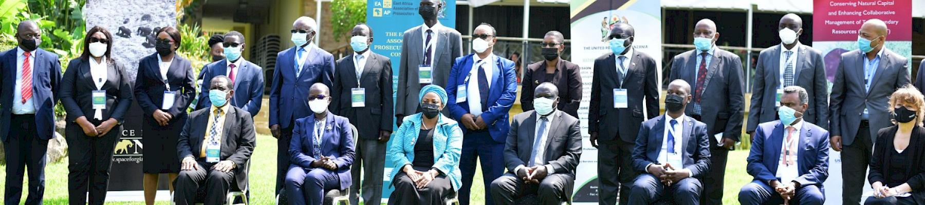 Hon. Bazivamo, in the middle, front row with the DPP of Tanzania on his right and the acting Arusha RC on his left posing in a photo with DPPs and Julie Thomson during the EAAP Conference